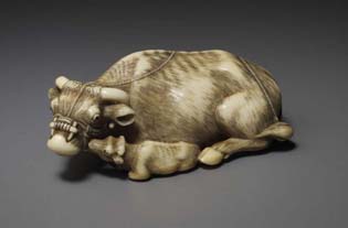 The ivory netsuke chosen to represent 2009 is a magnificently carved cow, 7.5 cm long, 45 grams, with her calf, the latter licking the mother’s muzzle, the long rope falling over the parent’s back, the ivory exquisitely patinated, both eyes inlaid in some dark material, probably horn signed Tomotada (Kyoto-school), mid 18th century.